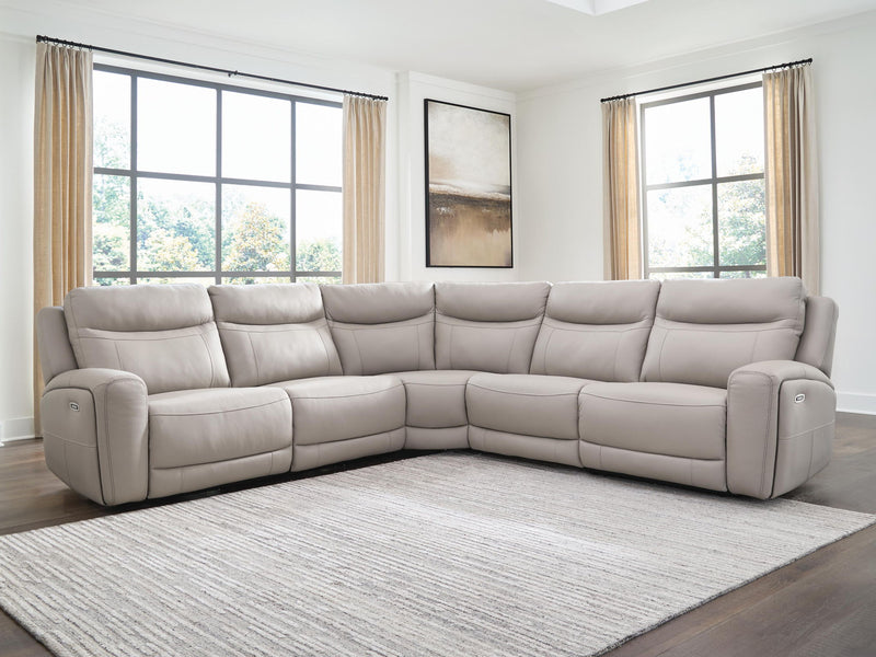 Benchcraft® Gravier reclining sectional sofa with plush cushions and modern design, shown in a living room setting.