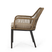 Modern Noble House wicker arm chair with water-resistant beige cushions, featuring a brown wicker frame for stylish outdoor dining.