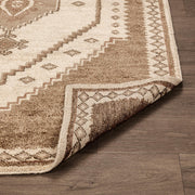 Hand-knotted Luxor area rug by Classic Home featuring intricate patterns and rich colors, ideal for living room or bedroom decor.