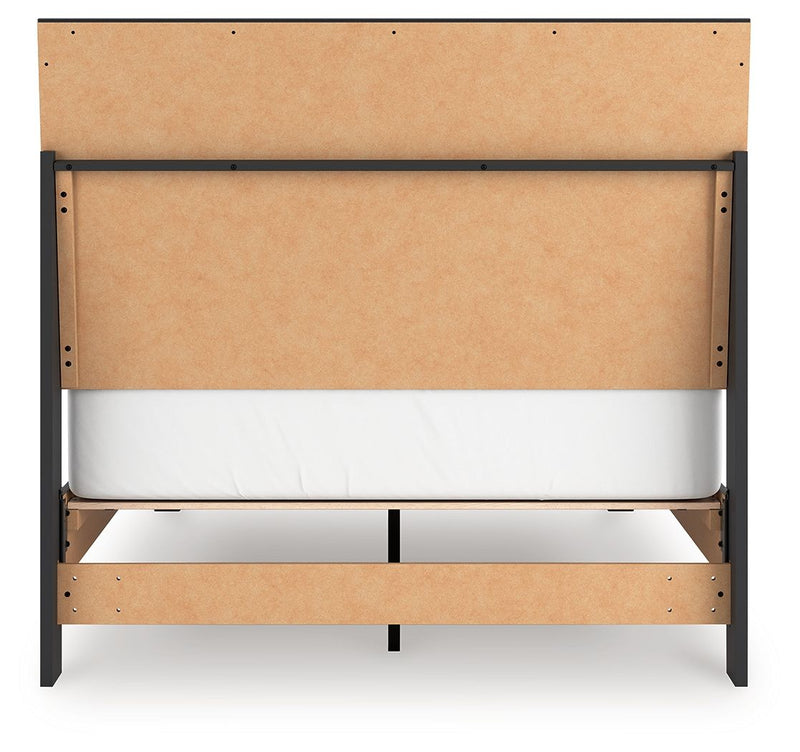 Signature Design by Ashley Danziar panel bed with low footboard, showcasing a modern wooden frame and sleek design.