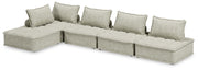 Signature Design by Ashley stationary sectional sofa with plush cushions and modern design, shown in a living room setting.