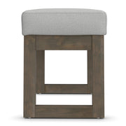 Simpli-Home Milltown upholstered ottoman bench with cushioned top and wooden legs, ideal for living room or bedroom seating.