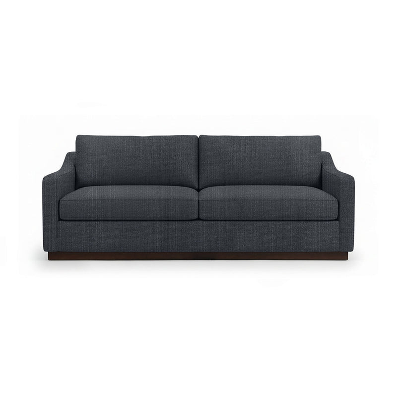 Classic Home Aspen stationary sofa with plush beige upholstery and stylish tufted backrest in a cozy living room setting.