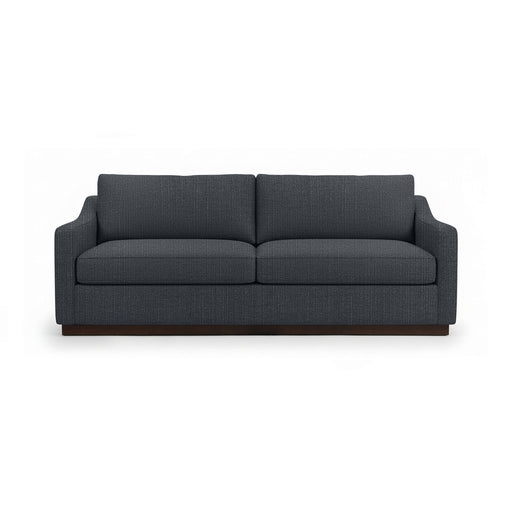 Classic Home Aspen stationary sofa with plush beige upholstery and stylish tufted backrest in a cozy living room setting.