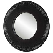 Uttermost sailor's knot round wall mirror with rope frame, nautical decor, and antique bronze finish, hanging on a wall.
