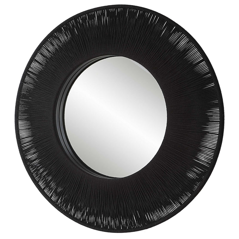 Uttermost sailor's knot round wall mirror with rope frame, nautical decor, and antique bronze finish, hanging on a wall.