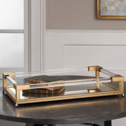 Gold mirrored tray by Uttermost featuring a sleek, reflective surface and elegant rounded edges, perfect for stylish tabletop decor.
