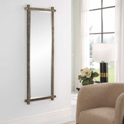 Uttermost Abanu ribbed dressing vanity mirror with sleek frame, reflecting a modern style suitable for bedroom or dressing area.
