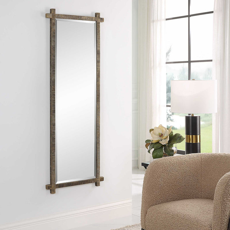 Uttermost Abanu ribbed dressing vanity mirror with sleek frame, reflecting a modern style suitable for bedroom or dressing area.