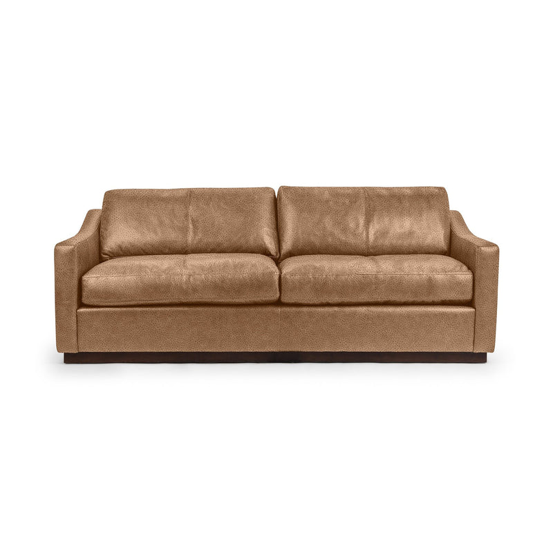 Classic Home Aspen stationary sofa with plush cushions and a modern design, shown in a cozy living room setting.
