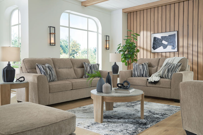 Benchcraft® Olten living room set with stationary chair and ottoman, featuring plush upholstery and modern design.