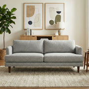 Livingston upholstered stationary sofa by Simpli-Home with plush fabric, wide armrests, and comfortable seating in a modern living room setting.