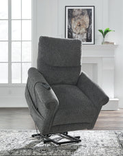 Signature Design by Ashley Aureta Power Lift Recliner in plush upholstery with padded armrests and built-in lift mechanism.