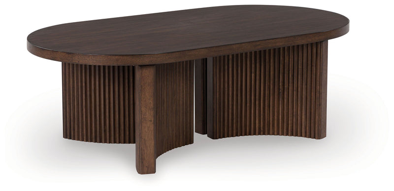 Korestone - Oval Cocktail Table - Dark Brown - R&R Furniture Gallery (Fountain Valley, CA)
