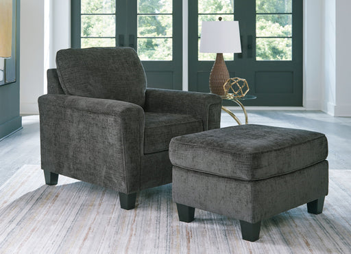 Benchcraft Erinslane living room set with stationary chair and matching ottoman, featuring plush upholstery and contemporary design.
