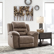 Signature Design by Ashley® Stoneland rocker recliner chair with plush cushioning and wooden base, ideal for comfortable relaxation.
