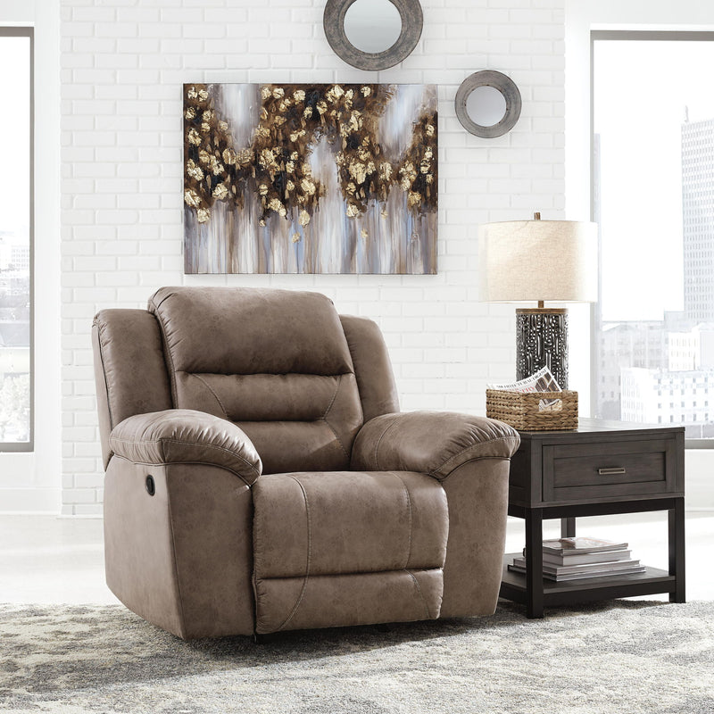 Signature Design by Ashley® Stoneland rocker recliner chair with plush cushioning and wooden base, ideal for comfortable relaxation.