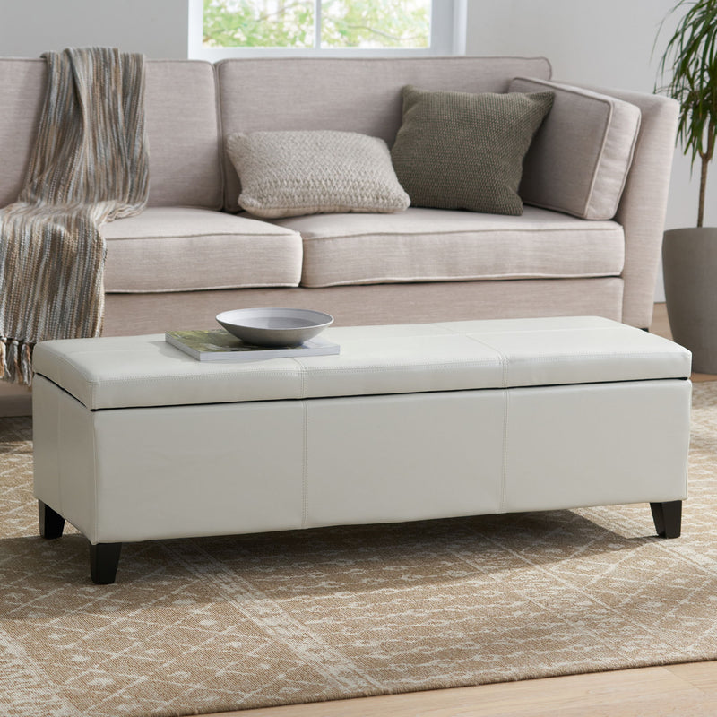 Noble House Glouster contemporary storage ottoman with plush fabric and wooden legs, versatile for living room decor.
