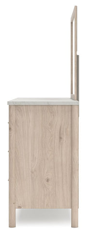 Signature Design by Ashley six-drawer dresser with sleek wood finish and modern hardware, featuring six spacious drawers for storage.