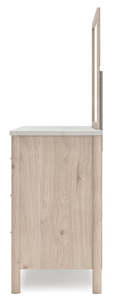 Signature Design by Ashley six-drawer dresser with sleek wood finish and modern hardware, featuring six spacious drawers for storage.