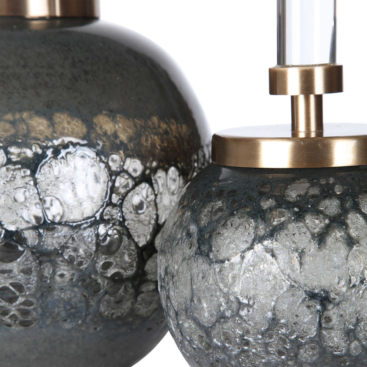Pair of dark gray art glass bottles vases by Uttermost, featuring smooth, rounded shapes for decorative display.
