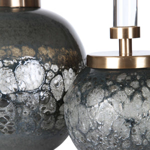 Pair of dark gray art glass bottles vases by Uttermost, featuring smooth, rounded shapes for decorative display.