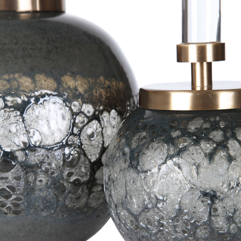 Pair of dark gray art glass bottles vases by Uttermost, featuring smooth, rounded shapes for decorative display.