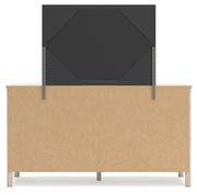 Signature Design by Ashley Cadmori Six Drawer Dresser with dark wood finish and sleek metal handles