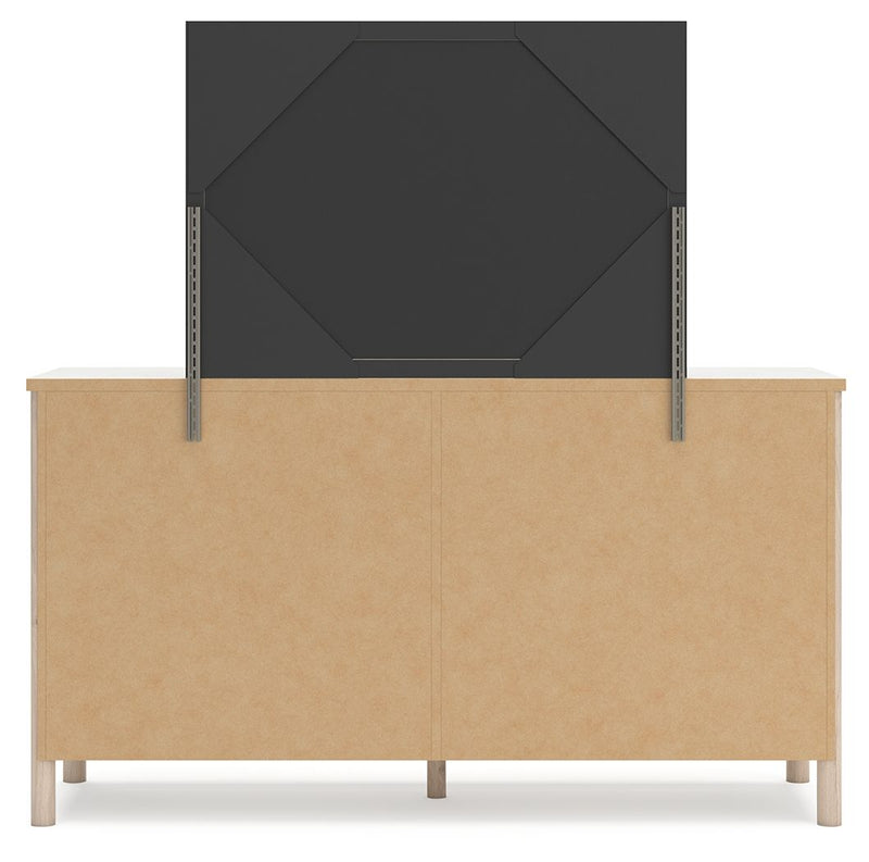 Signature Design by Ashley Cadmori Six Drawer Dresser with dark wood finish and sleek metal handles