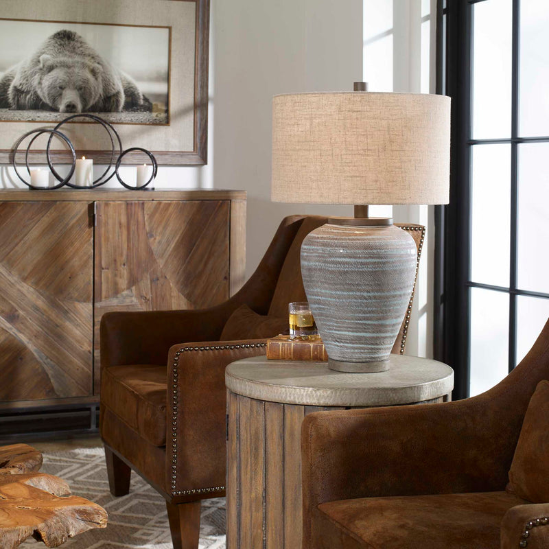 Uttermost Pelia table lamp in light aqua with a sleek ceramic base and fabric shade, ideal for modern home decor.