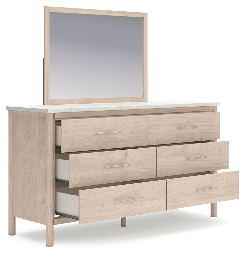 Signature Design by Ashley Cadmori six drawer dresser with sleek wood finish and modern hardware, showcasing ample storage space.