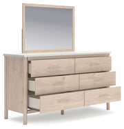 Signature Design by Ashley Cadmori six drawer dresser with sleek wood finish and modern hardware, showcasing ample storage space.