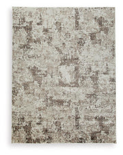 Signature Design by Ashley Barricland area rug with geometric pattern, soft texture, and neutral tones for modern home decor.