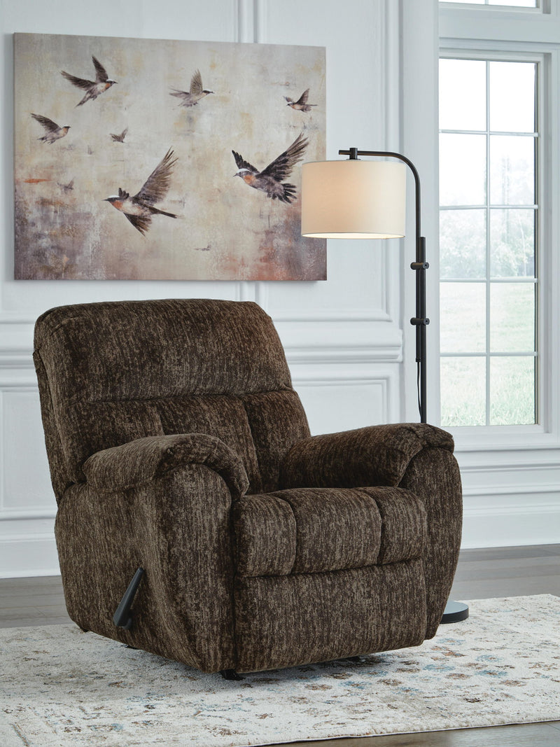 Signature Design by Ashley Stayfish rocker recliner with plush upholstery and wooden base, designed for comfort and style.