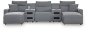 Salt and pepper recliner sectional sofa from Signature Design by Ashley, featuring plush cushions and reclining seats.