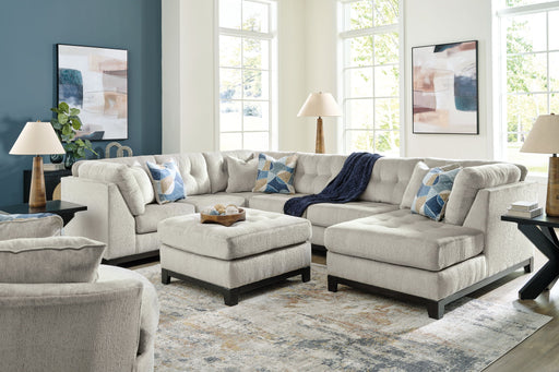 Benchcraft Maxon Place 5-piece living room set with sofa, loveseat, and armchairs arranged in a modern, comfortable living space.