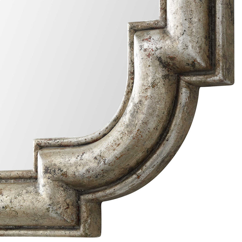 Uttermost Calanna wall mirror with antique silver finish, ornate frame design, reflecting a stylish decorative wall piece.