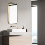 Uttermost Taft wall mirror with a sleek frame, hanging on a wall, showcasing modern home decor style.