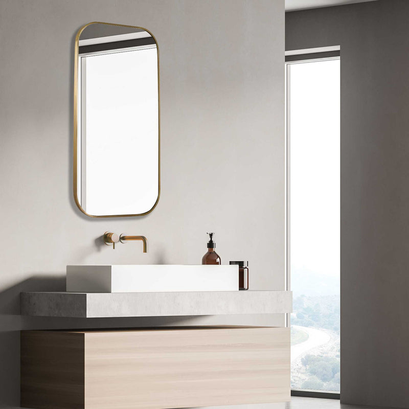Uttermost Taft wall mirror with a sleek frame, hanging on a wall, showcasing modern home decor style.