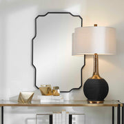 Black Iron Wall Mirror by Uttermost, featuring a sleek round design suitable for modern interior decor.