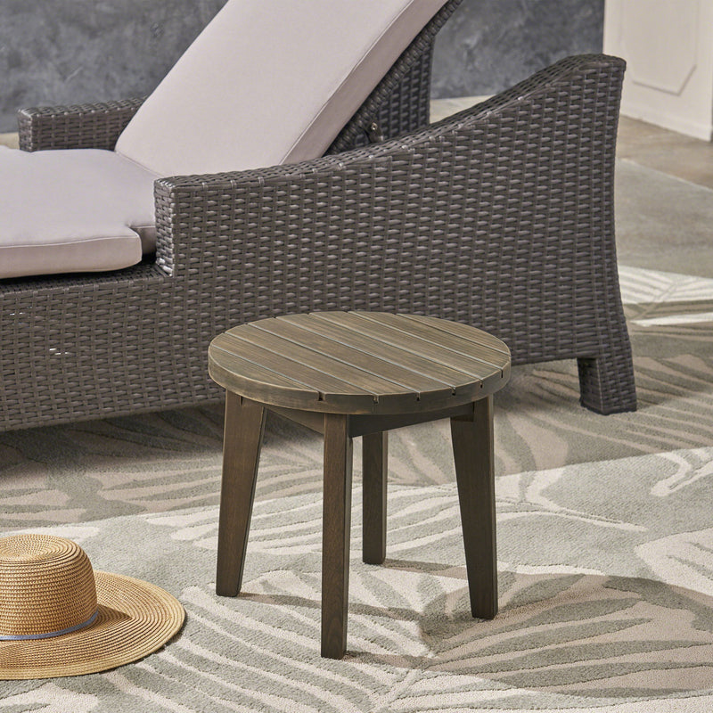 Noble House outdoor acacia wood side table with weather-resistant finish, featuring a sturdy design for outdoor patio use.
