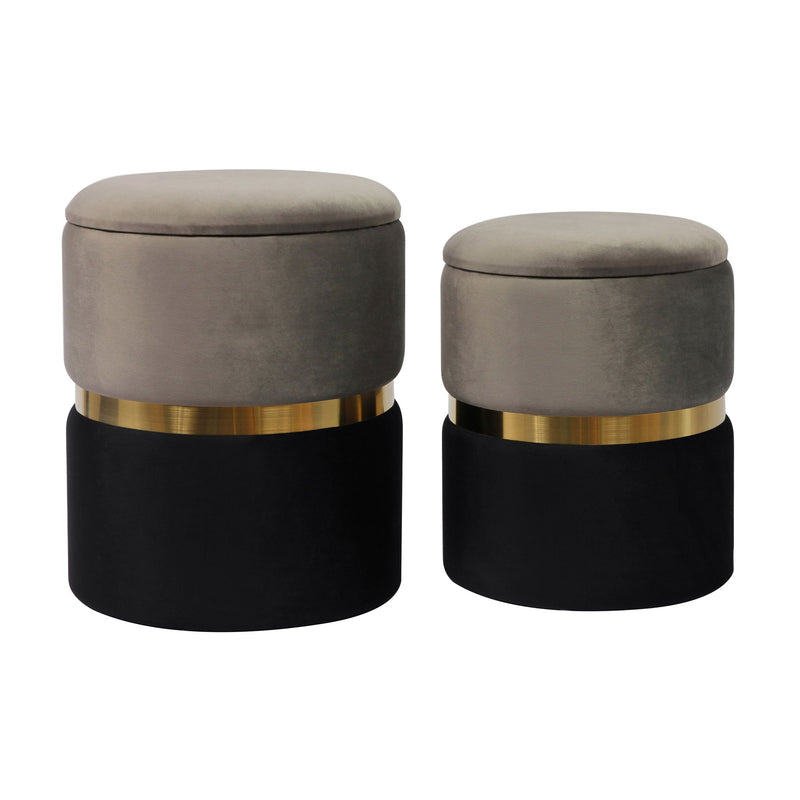 Pair of TOV Furniture Gigi Storage Ottomans with cushioned tops and wooden legs, shown side by side in a modern living room setting.
