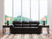 Midnight Glennbre stationary sofa by Signature Design Ashley, showcasing plush fabric cushions and a sleek, modern design.