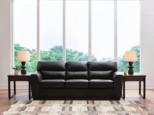 Midnight Glennbre stationary sofa by Signature Design Ashley, showcasing plush fabric cushions and a sleek, modern design.