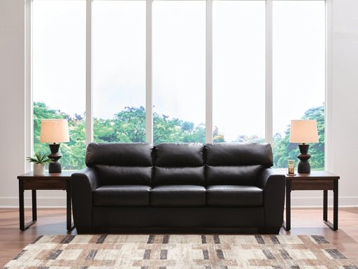 Midnight Glennbre stationary sofa by Signature Design Ashley, showcasing plush fabric cushions and a sleek, modern design.