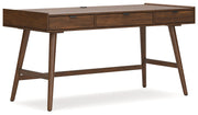 Signature Design by Ashley Lyncott home office desk with a spacious wooden surface and modern design for writing and workspace.