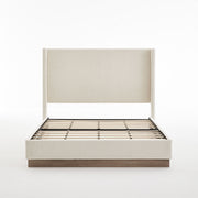 House & Home Furniture Hosford minimalist upholstered wingback bed with wood platform base, shown in beige fabric with tall winged sides.