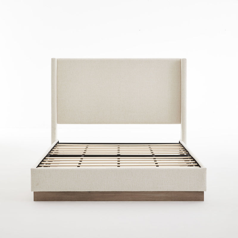 House & Home Furniture Hosford minimalist upholstered wingback bed with wood platform base, shown in beige fabric with tall winged sides.