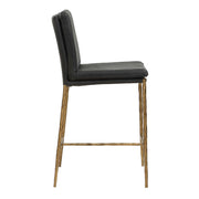 Uttermost Ascend counter stool with a sleek wooden seat and black metal legs, designed for counter height (24-27 inches).