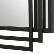 Uttermost Amherst wall mirror with a sleek, modern frame, hanging on a wall in a contemporary interior.